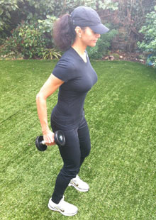 Efua Baker demonstrates the first stage of a tricep extension