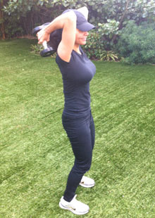 Efua Baker demonstrates the first stage of a tricep raise