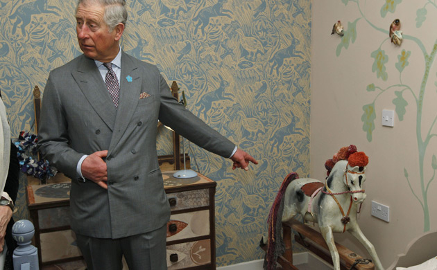 Prince Charles Ideal home: Prince Charles at the Ideal Home Show pointing at a rocking horse