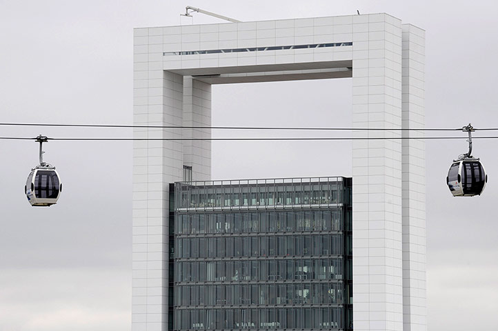 Floriade: Two gondolas pass the innovation tower at Floriade
