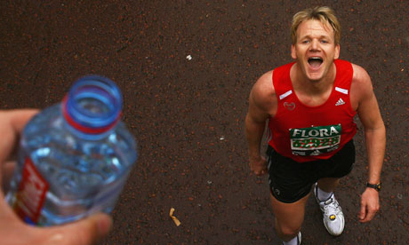 Gordon Ramsey stops for a drink during the London Marathon