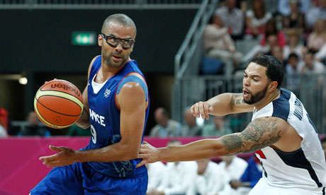 France's Tony Parker drives past Deron Williams of the USA in the Olympics 2012 men's basketball