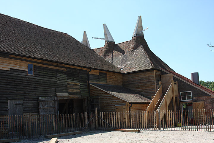 Great Dixter: An exterior view of the Great Dixter Great Barn and Oast House