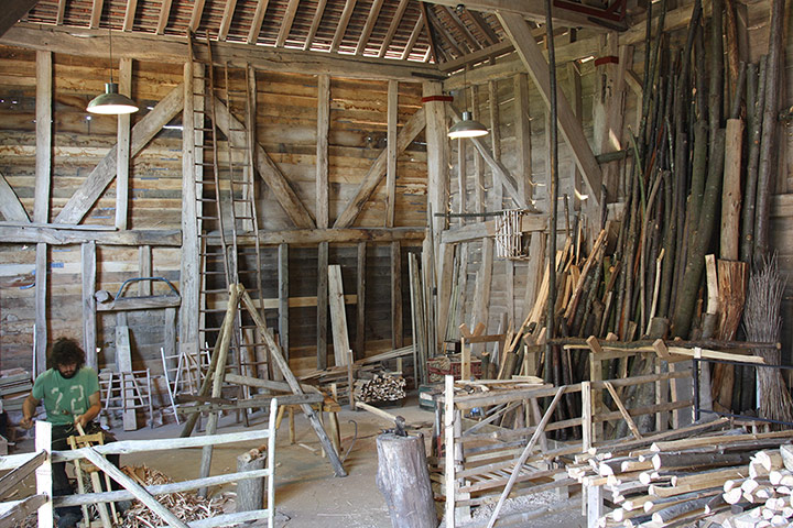 Great Dixter: Great Dixter barn with Dixter chestnut being used for hurdles