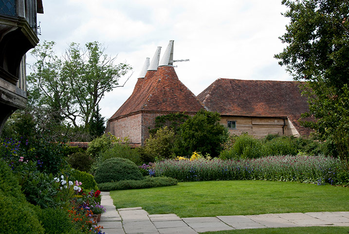Great Dixter: An exterior view of the Oast House and Great Barn at Great Dixter