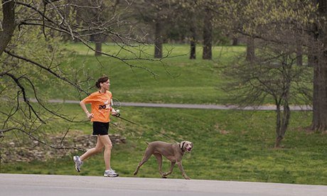 Woman running with her dog