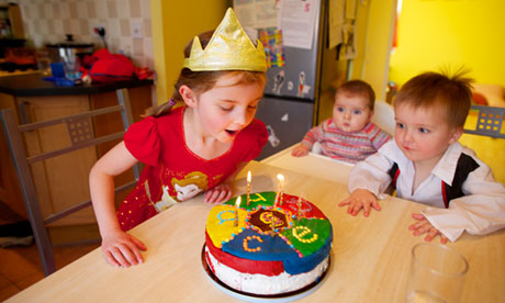 Five year old Grace Key blows out her birthday candles
