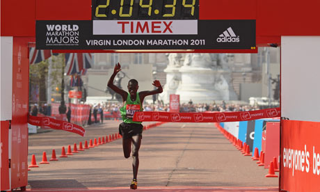 Kenyan athlete Emmanuel Mutai crosses the line to win the 2011 Virgin London Marathon 