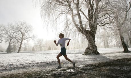 Park runner battling through snow, frost