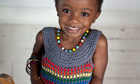 Girl wearing rainbow bright dress