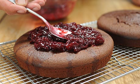 Dan step 6: Take the cakes out of tins. Spoon 2-3 tbsp of kirsch on top. Put cherry mix on top