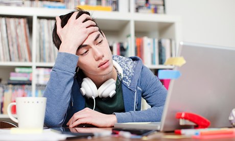 Male student using his laptop