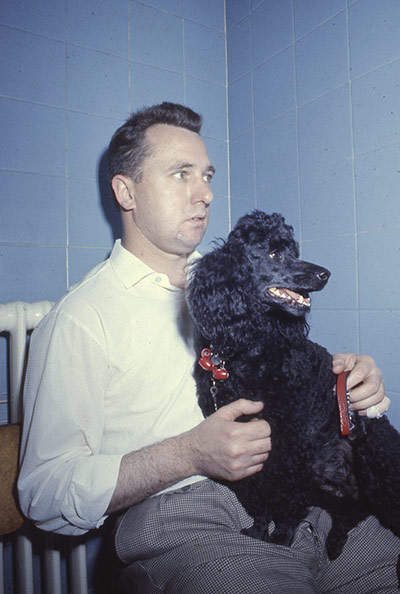 Vintage Blue Cross photos: Man waiting with his dog
