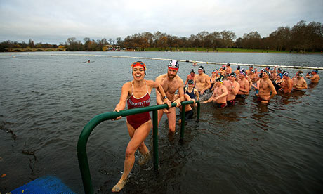 Serpentine Swimming Club members emerge from their traditional Christmas Day dip in Hyde Park, Londo