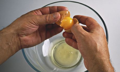 Egg white and yolk being separated