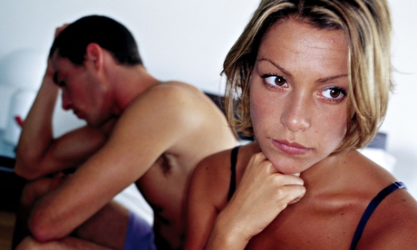 Worried couple in bed