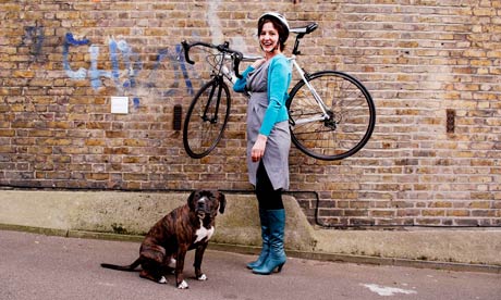 Zoe Williams with her bicycle and her dog