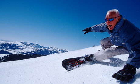 Older man on snowboard