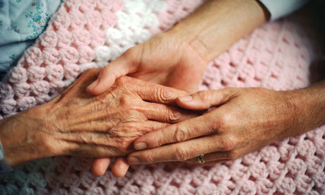 Holding hands with elderly patient