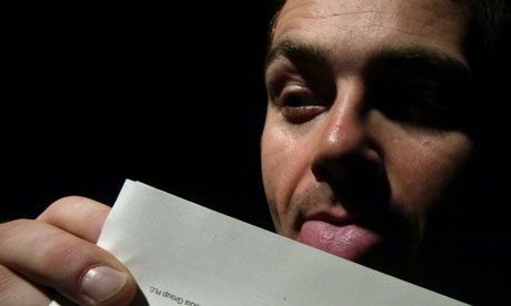 Man sealing envelope