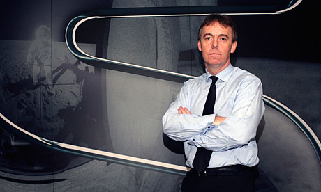 Jeremy Darroch poses beside a giant Sky logo