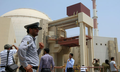 An Iranian security man stand