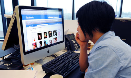 woman views her Facebook profile