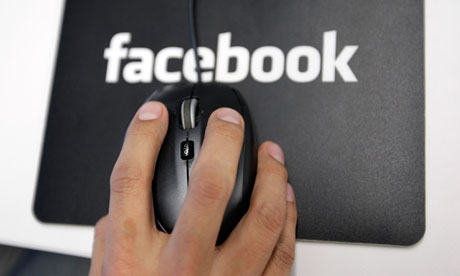 Facebook logo with hand on mouse