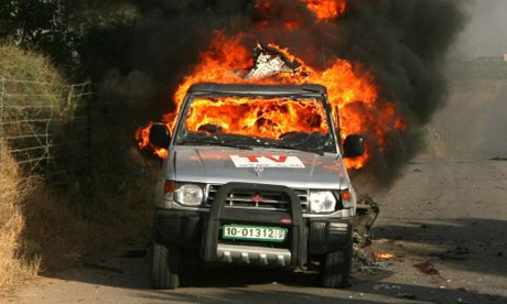 Car of Reuters cameraman Fadel Shana burning in Gaza