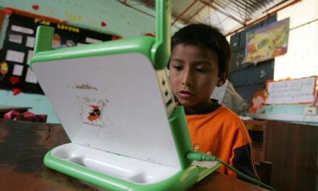 An eight-year-old Peruvian boy uses one of Microsoft's non-profit XO laptops