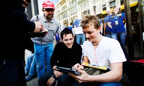 The media interview people queuing outside the Apple Store before the launch of the iPad