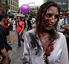 People dressed as zombies promote The Walking Dead at Comic-Con in San Diego