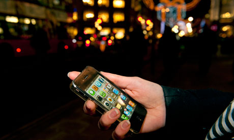 Christmas shopping and comparing prices on-line on an iPhone. 