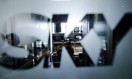 Sky Italia logo on a window, with a studio beyond it