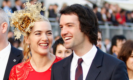 File photo of British actress Winslet and her then boyfriend Rocknroll in Hong Kong