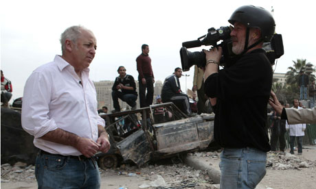 Jeremy Bowen with a BBC TV crew on Tahrir Place in Cairo, Egypt
