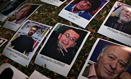 Photographs of journalists killed at Charlie Hebdo during a vigil at France’s embassy in Mexico