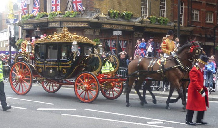 A working life 070511: A carriage passes by on the royal wedding route