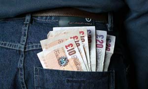 &pound;10 notes in a back pocket
