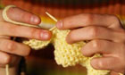 A Person Knitting