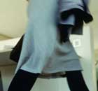 A woman walks past a desk in her office as she leaves