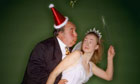 Boss tries to kiss worker under mistletoe at office Christmas party
