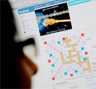 A worker playing Scrabulous on their computer