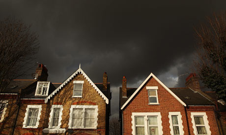 Storm clouds pass over houses in south London