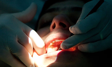 A dentist examining teeth