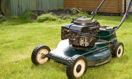 A woman using a lawnmower