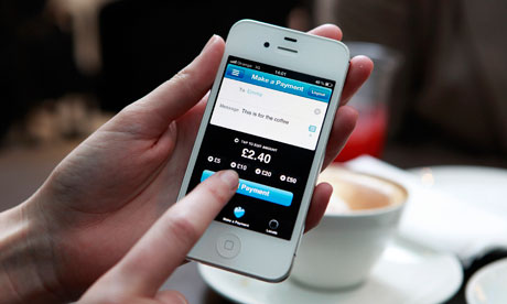 Barclays Pingit app running on a smartphone being used in a coffee shop