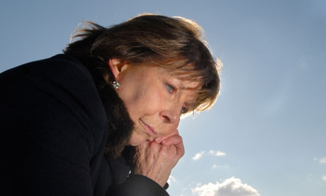 An older woman looking worried