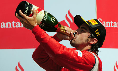 Fernando Alonso celebrates winning the F1 Santander British Grand Prix