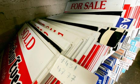 For sale signs stacked up